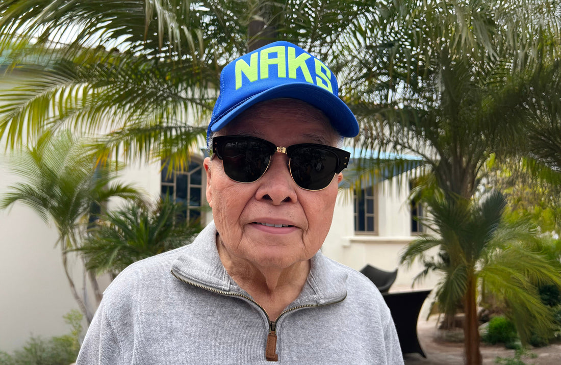 Blue Naks trucker hat with yellow type