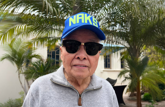 Blue Naks trucker hat with yellow type